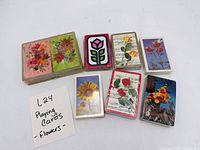 Group view of all decks showing designs and plastic case