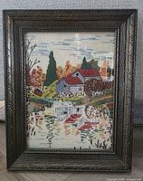 Full view of framed crewel embroidery artwork