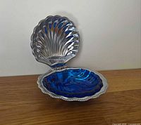 Dish open showing silver-plated shell and cobalt liner