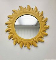 Front view of wooden sunburst mirror