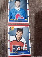 Front view of both 1990 Score hockey cards