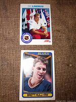Both hockey cards laid out on fabric surface