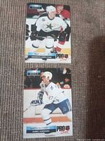 Both rookie cards side by side on carpet
