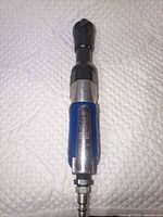 Full view of ratchet wrench showing blue grip, chrome lever, quick-connect fitting attached