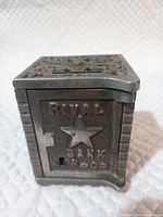 Front view showing raised lettering, star motif and keyhole