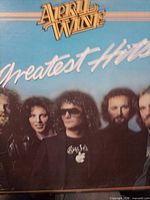 Front cover showing April Wine Greatest Hits title and band photo