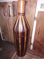 Full view of bamboo and wood striped floor vase