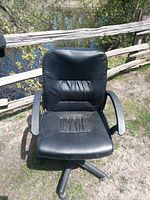Front view showing seat, backrest, armrests, caster base