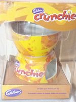 Boxed Cadbury Crunchie ceramic twin fondue set front view showing pots through clear window