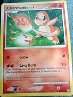 Front view of Charmander 52/132 card showing artwork, stats and condition