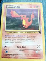 Front of Charmander card displaying artwork, HP, text