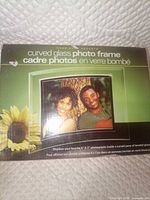 Front of boxed Cherished Accents curved glass photo frame