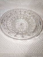 Overhead view of clear crystal bowl showing diamond pattern and starburst base