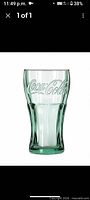 Single green Coca-Cola embossed glass tumbler front view