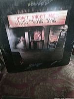 Front of Elton John LP cover showing marquee artwork