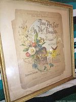 Front view of framed sheet music cover