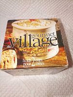 Front of boxed Gourmet Village dip chiller