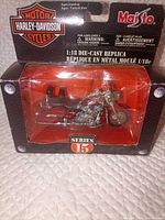 Front of boxed red Harley-Davidson die-cast model