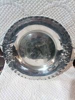 Full view of round pewter tray showing overall design and condition