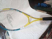 Full view of Matrix racquet showing color scheme and strings