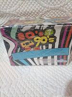 Sealed box front with 80's & 90's Trivia branding