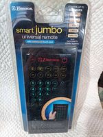 Front view of sealed Emerson Smart Jumbo universal remote in blister packaging.