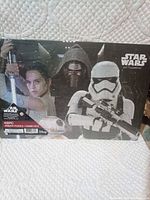 Front of sealed puzzle box showing main character montage