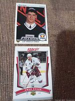 Front views of both hockey cards showing players and designs