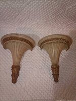 front view of both plaster corbels