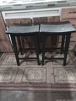 Front view of both stools showing overall condition and style