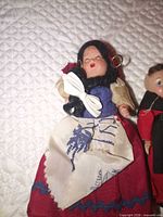 Female doll close-up showing costume details and face