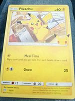 Front view of Pikachu card showing artwork, HP, attacks, set number