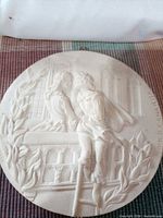 Full view of round plaster relief