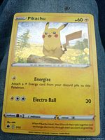 Front of Pikachu 7/15 promo card, shows artwork, attacks and condition