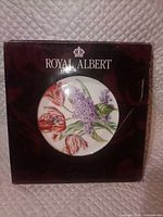 Front of boxed Royal Albert Lilacs plate