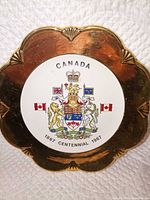 Front view showing Canada coat of arms and gold rim