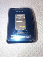 Front view of blue Sony WM-FX177 Walkman showing on/off switch, Mega Bass and anti-rolling labels