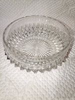 Side view of clear diamond point pressed glass bowl