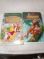 Front view of both VHS tapes with cases