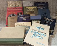 Front view showing 13 pottery and ceramics reference books, titles visible