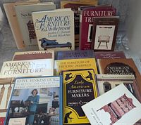 All seventeen antique furniture reference books grouped together, covers visible