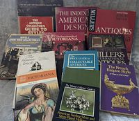 Front view of 12 antique collecting books showing titles