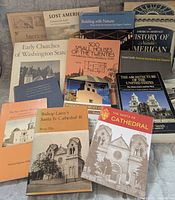 All 13 books displayed upright showing front covers