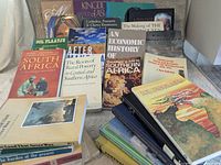 Front view showing multiple book covers including South Africa: A Modern History, After Mandela, An Economic History of West Africa and others