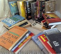 Overview of all books in three stacks showing spines and covers