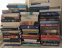 Overall view of three vertical stacks showing majority of the 50 hardcover books