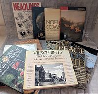 Front view showing eight of the oversized hardcovers in the lot