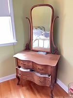 Full view of vanity showing drawers, mirror, legs