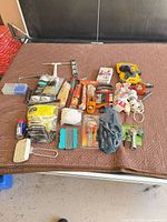 Overall view of assorted hand tools and hardware items