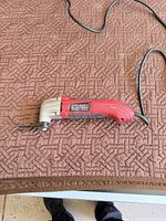 Full view of Chicago Electric oscillating tool with cord and blade